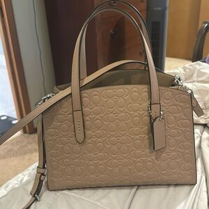 Beige Coach purse. Brand new.